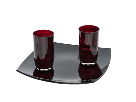 two claret glasses on a black plateの写真素材