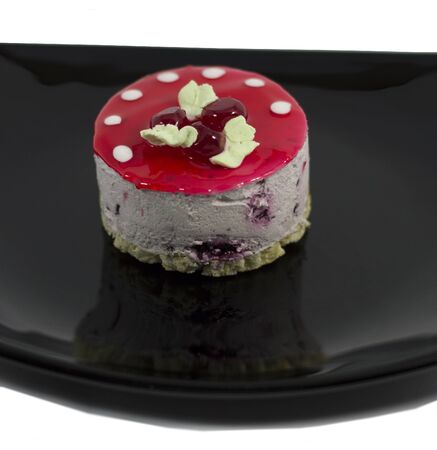 cream cake in the form of a mushroom on a plate, close upの写真素材