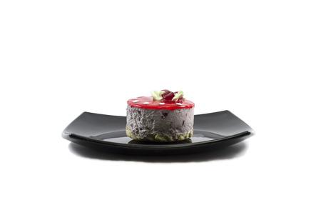 cream cake in the form of a mushroom on a plateの写真素材