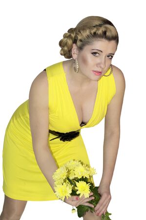 the beautiful woman with a bouquet of yellow flowersの写真素材