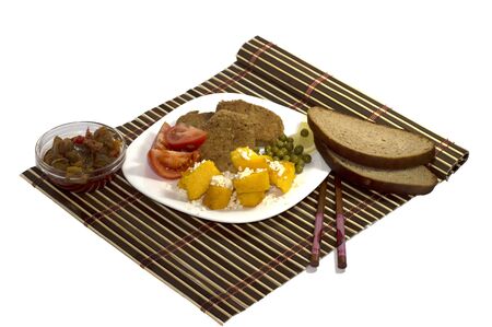 vegetarian food with sauce and with bread, on a white plate, the top viewの写真素材