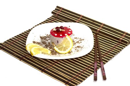 cake white, with lemon segments, with grated chocolate, on a rug, the top viewの写真素材