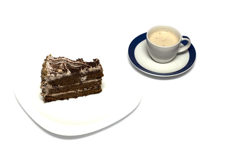 chocolate cake and mug from a cappuccino on a saucerの写真素材
