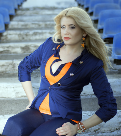 the beautiful girl is photographed at stadiumの写真素材