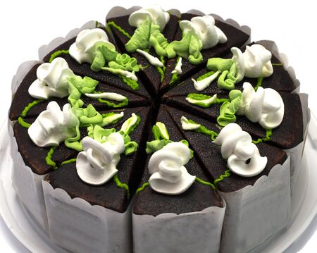 chocolate pie with green and white cream, largely, on a plastic trayの写真素材