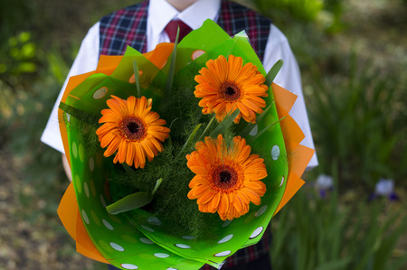 the school student with flowers, a close upの写真素材