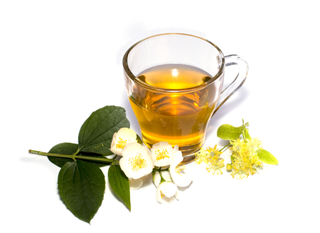 glass of the lime tea decorated with flowersの写真素材