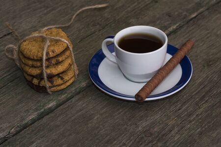 coffee and linking of oatmeal cookies on the rightの写真素材
