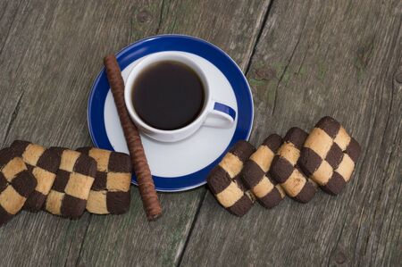 two rows of cookies and coffee of a circleの写真素材