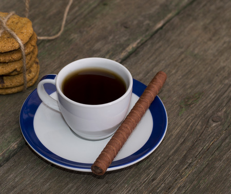 cup of black coffee on the old shabby desktopの写真素材