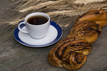 black coffee and roll with poppyの写真素材