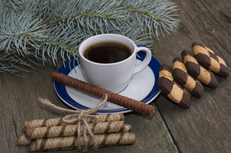 coffee with cookies and a fir-tree branchの写真素材