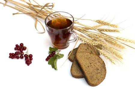 glass of tea, wheat about fields and breadの写真素材