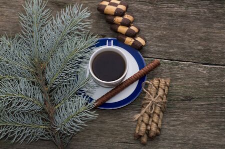 still life from a fir-tree branch, cookies and black coffeeの写真素材