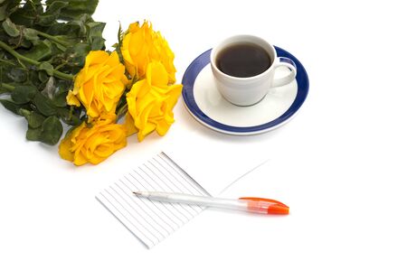 cup of coffee, bouquet of yellow roses and notebook with the handle, the isolated imageの写真素材
