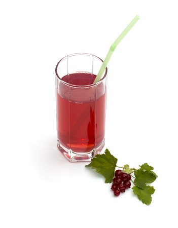 tall glass of juice and nearby branch of red currant, subject drinksの写真素材