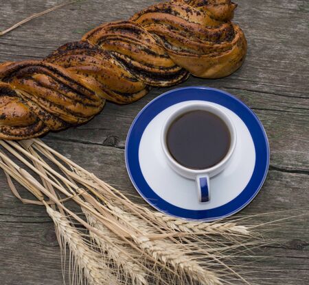 roll, ears of wheat and coffee, the top view, still life on a subject drinks and foodの写真素材