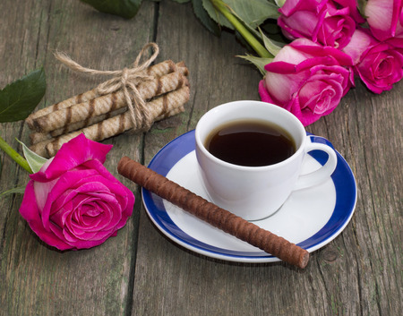 coffee still life, cookies in the form of sticks and a rose on each side, a subject food and drinksの写真素材