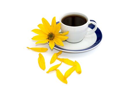 still life cup of coffee, yellow flower and nearby petals, isolate, subject flowers and drinksの写真素材