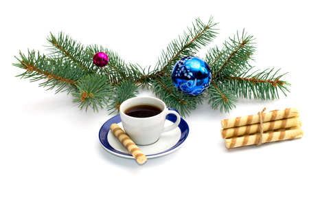 fir-tree branch with ornament, a cup of coffee and a linking of cookies, a festive card, the subject Christmas and New Yearの写真素材