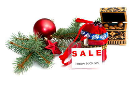 fir-tree branch, bag, hazelnuts and label with an inscription New Year's sale, isolate, winter, the subject Christmas and New Yearの写真素材