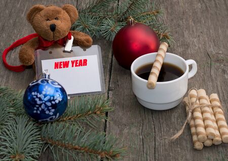 coniferous branch, coffee, baking and toy bear with a label New Year, the subject Christmas and New Yearの写真素材