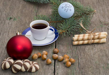 two groups of cookies, coffee, Christmas tree decorations and coniferous branch, still life, subject Christmas and New Yearの写真素材