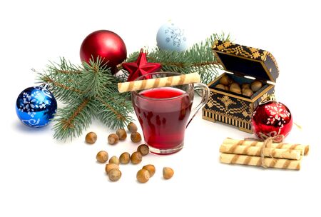 nutlets, tea and coniferous branch with Christmas tree decorations, a still life, the subject Christmas and New Yearの写真素材