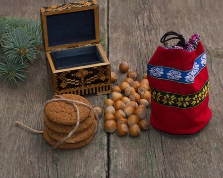 open casket, red gift bag, forest nutlets and linking of cookies, subject holidays Christmas and New Yearの写真素材