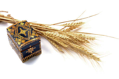 yellow casket and grain ears, isolate, subject products