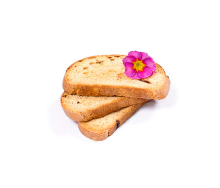 three croutons decorated with a pink flower isolate, a subject food