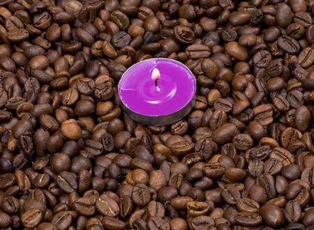 the burning candle on coffee grains, a subject drinks and holidaysの写真素材