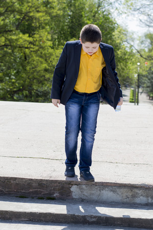 the school student goes down on steps in the park, a subject school students, children, a game, the school student after study walksの写真素材