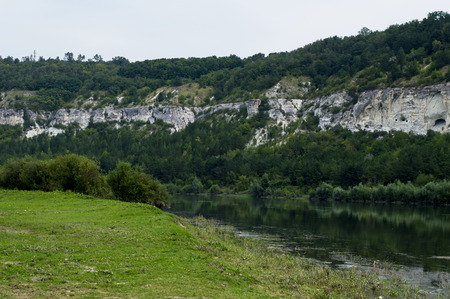 the river near the green wooded banks, the theme of beautiful natureの写真素材