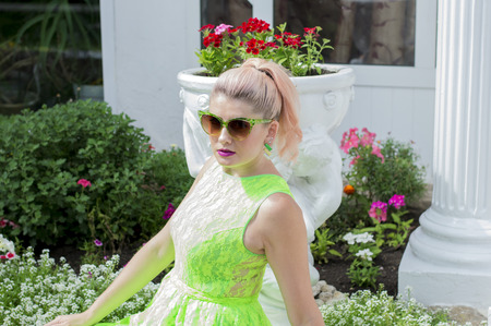 portrait of a beautiful woman at the flower decorations, the theme of beautiful vibrant womenの写真素材