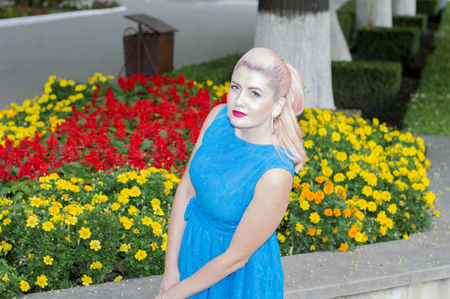 beautiful blonde from the flower beds, the theme of beautiful vibrant womenの写真素材