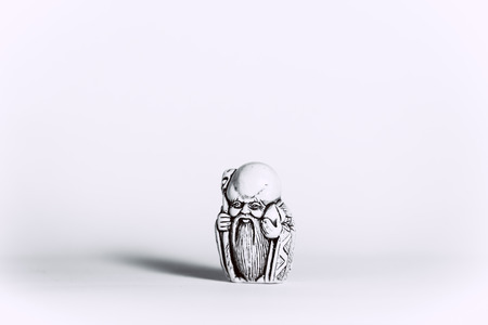 figurine the monk on a white backgroundの写真素材