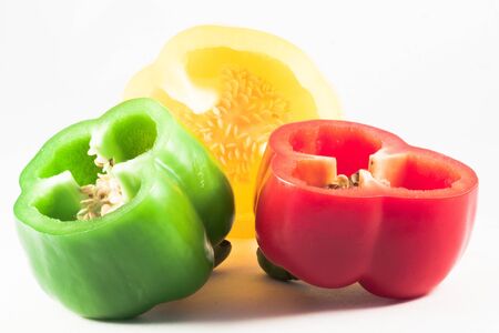 Sliced â€‹â€‹yellow, red and green peppers isolated on a white background