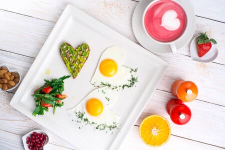 scrambled eggs with toast with avocado and fresh coffeeの写真素材
