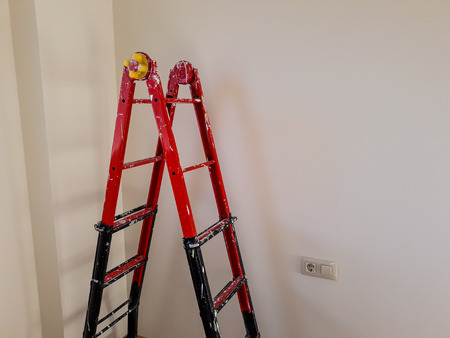 Different angles of a painter's ladder in a room to be refurbishedの写真素材