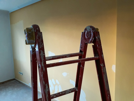 Different angles of a painter's ladder in a room to be refurbishedの写真素材