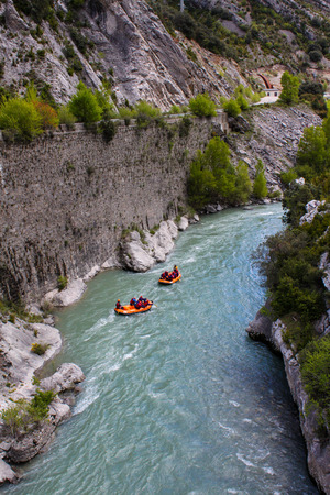 Rafting in a river of Huesca, Spain. Rafting at Tara mountain river. Group of tourists in the inflatable raftの写真素材