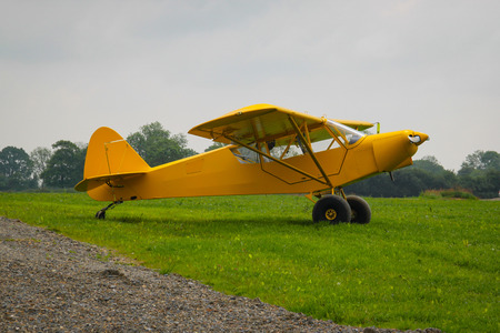 Taylorcraft L-2. American reconnaissance aircraft in World War II. Painted yellow for exhibition