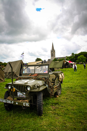 Normandy, France; 4 June 2014: Image of an American army jeep in Normandy in a camp. Recreation on the 70th anniversary.のeditorial素材