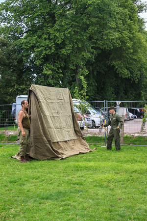 Normandy, France; 4 June 2014: View of recreation camp in Normandy for the 70th anniversary with vehicles, tents and peopleのeditorial素材