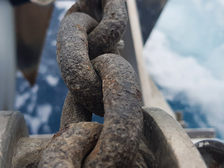 Anchor winch with anchor bottom and sea with waves bottomの写真素材