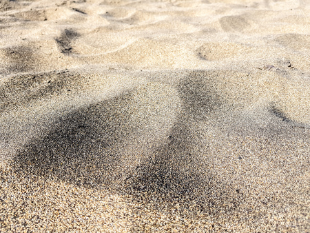 Volcanic beach sand, darker color, almost black. Picture taken on a beach in Lanzarote, Canary Islands, Spainの写真素材