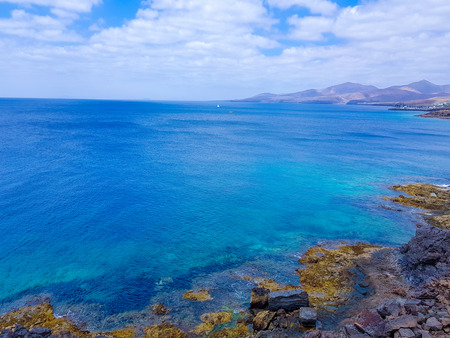 sea coast at volcanic island in Lanzarote, Spainの写真素材