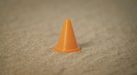 Attention signal on beach sand and with spaces around the motif to be able to put texts. Perfect for backgroundsの写真素材
