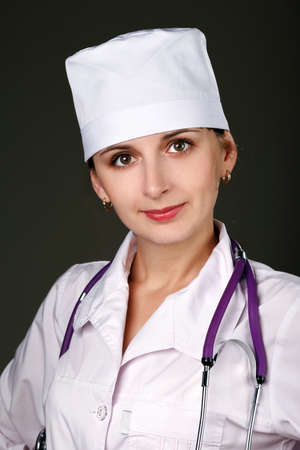 beautiful woman doctor on a grey backgroundの写真素材